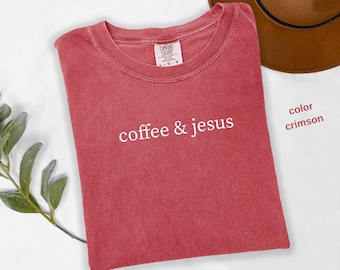 May include: Crimson red t-shirt with the text "coffee & jesus" in white.
