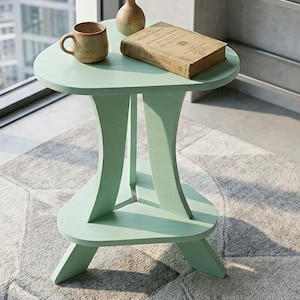 May include: A set of three ceramic mugs with a speckled, matte finish. The mugs are in shades of cream, light gray, and dark gray. Each mug has a simple, minimalist design and a rounded handle.