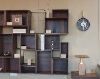 Modular Wall Shelving Unit, solid wood shelves, heat-blackened steel wall-mounted frame, minimalist storage for living room or office