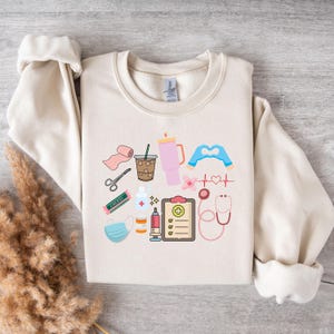 Work Cute Nurse Shirt Nurse Healthcare Themed Graphic Sweatshirt  Cute Nurse Appreciation Gift Medical Staff Sweatshirt Cozy Unisex Crewneck