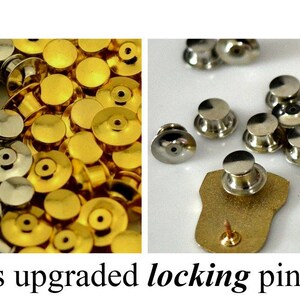 May include: A close-up of a large quantity of gold and silver pin backs. The pin backs are designed to be used with a variety of pins and badges. The image includes the text "includes upgraded locking pin back(s)".