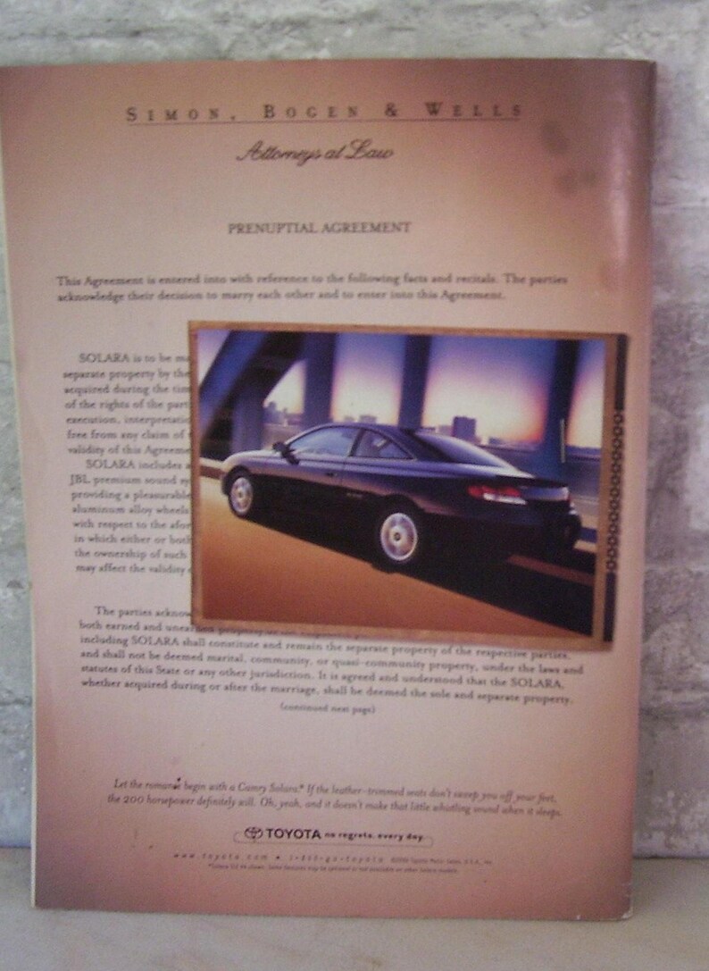 May include: A black and white legal document with the title "Prenuptial Agreement" and the text "SOLARA" repeated multiple times. The document is from the law firm Simon, Bogen & Wells. The document is accompanied by a photo of a black Toyota Solara driving on a road with a bridge in the background. The ad text reads "Let the romance begin with a Camry Solara?" and "If the leather trimmed seats don't sweep you off your feet, the 200 horsepower definitely will. Oh, yeah, and it doesn't make that little whistling sound when it stops."