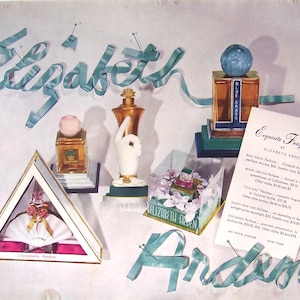 May include: Vintage advertisement for Elizabeth Arden perfumes. The image features various perfume bottles and packaging, including a triangular box and a bottle with a hand-shaped design. The text "Elizabeth Arden" and "Exquisite Fragrances" are visible.