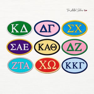 May include: Nine oval embroidered patches featuring Greek letters in various color combinations. The patches include combinations like green and white, pink and blue, yellow and blue, purple and white, yellow and black, pink and green, blue and pink, red and yellow, and light blue and dark blue.