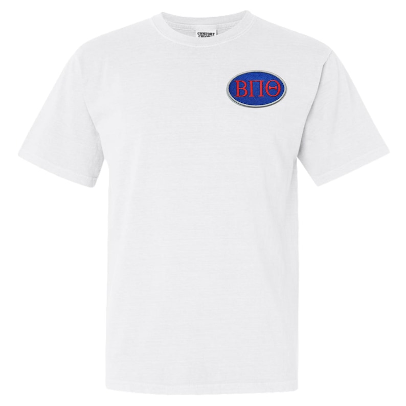May include: A white t-shirt featuring a small embroidered emblem on the chest. The emblem is an oval shape with a blue border, and the letters "B", "&Pi;", and "&Theta;" in red. The shirt has short sleeves and a crew neck.