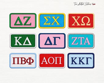 May include: A collection of nine rectangular embroidered patches featuring Greek letters in various color combinations, including pink, green, blue, red, and white. Each patch has a distinct border color and text, with the logo Two Artful Sisters visible.
