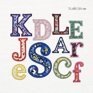 May include: A collection of embroidered fabric letters in various colors and floral patterns. The letters include K, D, L, E, J, S, A, r, e, C, and f. Each letter has a different floral design and color scheme, with a white background.