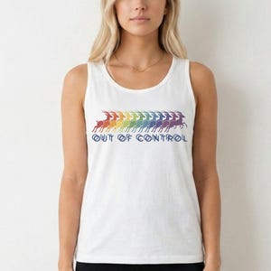 May include: A white sleeveless tank top featuring a graphic of a line of leaping gazelles in a rainbow gradient pattern. Below the gazelles, the text "OUT OF CONTROL" is printed in a dark blue, stylized font across the center of the chest.