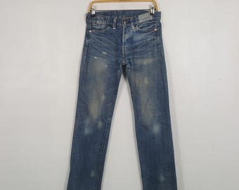 Vintage Levi's 501 Selvedge japanska märkes slitna denimjeans