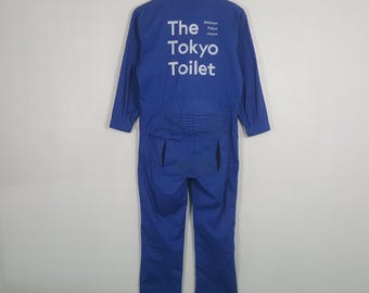 Mono de trabajo azul vintage con defectos desgastados, estilo Tokyo Toilet Workwear.