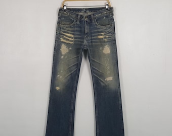 Vintage blå blå slitna denimjeans