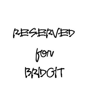 Puede incluir: Fondo blanco con texto negro que dice "RESERVED for BRIDGIT". El texto está escrito a mano en un estilo informal, ligeramente desigual, con la palabra "RESERVED" en un tamaño de fuente más grande.