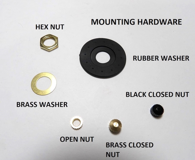 May include: Assortment of mounting hardware for a switch or knob, including a hex nut, brass washer, rubber washer, black closed nut, open nut, and brass closed nut.