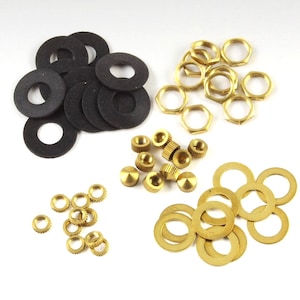 May include: Assortment of gold-colored metal hardware for crafts and DIY projects. The set includes washers, nuts, screws, and small round spacers. There are also black rubber washers.