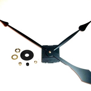May include: Black clock hands with a black mounting plate and gold-colored mounting hardware. The hands are designed for a clock with a 12-inch diameter face.