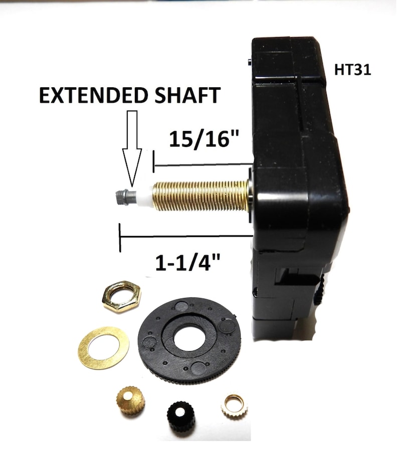 May include: Black clock movement with an extended shaft, labeled "HT31" and "EXTENDED SHAFT". The shaft measures 1-1/4" long and 15/16" in diameter. The movement comes with a black plastic gear, a gold washer, a gold nut, a gold crown, a black crown, and a gold washer.