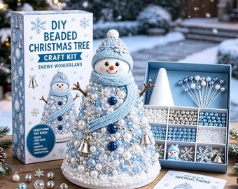 May include: A DIY beaded Christmas tree craft kit featuring a snowman-shaped tree covered in blue, white, and silver beads, snowflakes, and bells. The set includes a box with compartments for beads, pins, a cone base, and an instruction booklet.