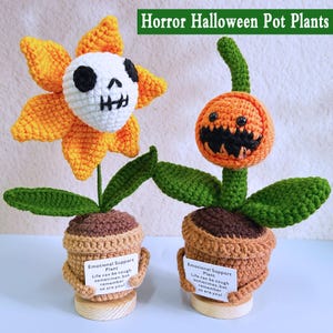 May include: Two crochet Halloween pot plants. One is a yellow flower with a skull face, the other is an orange pumpkin face. Both have green leaves and are in brown pots with the text "Emotional Support Plant". The text "Horror Halloween Pot Plants" is at the top.