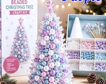 May include: A DIY beaded Christmas tree craft kit featuring a cone-shaped tree covered in purple, blue, and white beads with a star topper. The set includes a box with compartments for assorted beads, pins, and a white cone base for assembly.