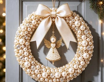 May include: A circular wreath covered in cream-colored pearls and clear faceted crystals. A large, smooth cream satin ribbon bow is tied at the top. A gold-toned angel ornament with pearl-encrusted wings and a dress hangs from the center of the bow.