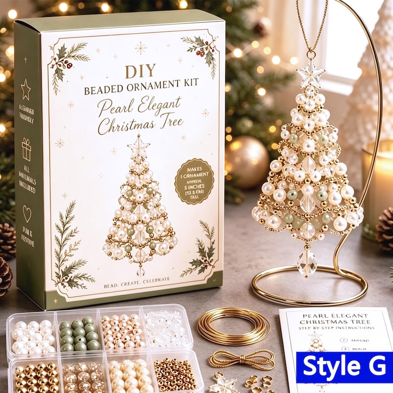 May include: A DIY beaded ornament kit box labeled Pearl Elegant Christmas Tree with a finished tree ornament on a gold stand. The kit includes white, green, and gold beads, wire, and instructions to create a 5-inch tall Christmas tree ornament.