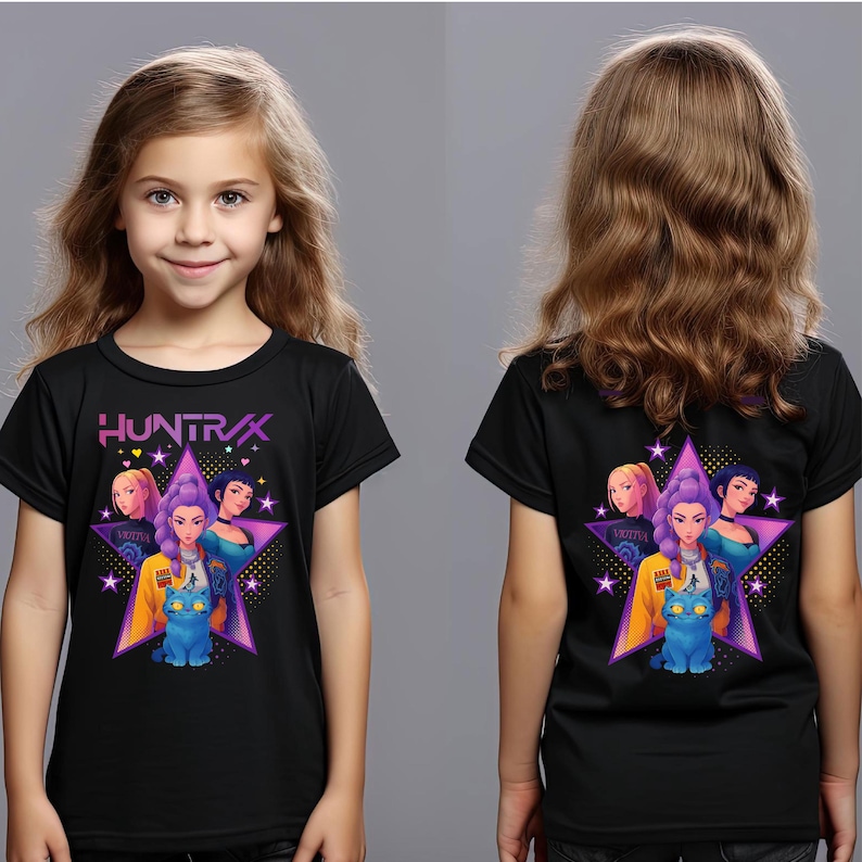 May include: Black t-shirt featuring a graphic design with the text "HUNTRAX" and a star-shaped design with illustrations of women and a blue cat. The shirt is worn by a young person.