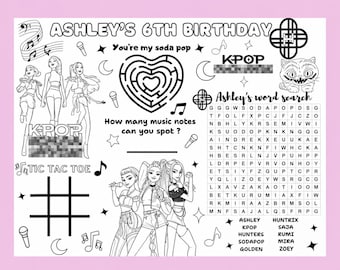 May include: A black and white activity sheet for Ashley's 6th birthday featuring K-pop themed illustrations, a heart-shaped maze, a tic-tac-toe grid, and a word search puzzle. The design includes music notes, microphones, stars, moons, and a cat.