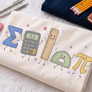 May include: A cream-colored fabric featuring a colorful graphic print of five anthropomorphic math-themed characters: a blue sigma symbol, a grey calculator, a tan ruler, a green protractor, and a yellow pi symbol, all surrounded by small stars.