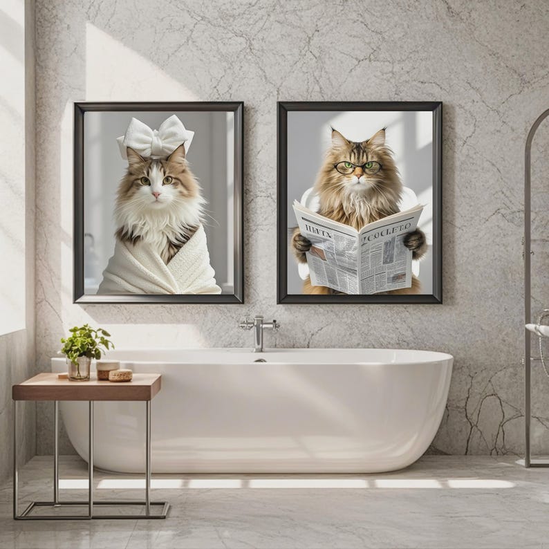 May include: Two framed cat portraits in a bathroom setting. One cat wears a bow and is wrapped in a white towel. The other cat wears glasses and reads a newspaper with the text "HAT'S COLETTO".