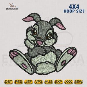 May include: Embroidered design of a gray rabbit with pink ears and nose, sitting with its arms crossed. The design is for a 4x4 inch embroidery hoop.