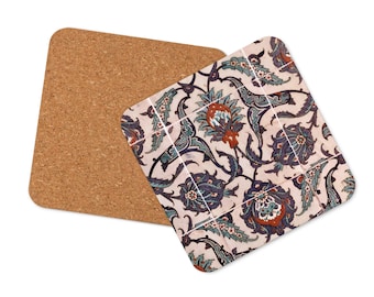 May include: A set of two cork-backed coasters featuring a traditional Turkish tile design with blue, green, and red floral patterns on a white background.