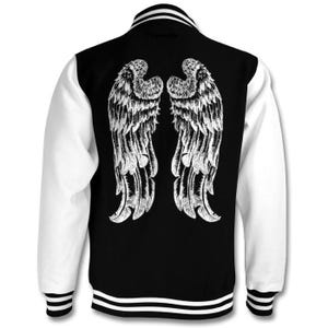 May include: A black and white varsity jacket with white angel wings on the back. The jacket has white sleeves and a black body with white stripes on the cuffs and waistband.