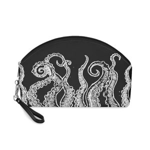 May include: Black and white makeup bag with a graphic print of an octopus with tentacles.