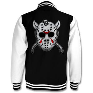 May include: Black and white varsity jacket with a white hockey mask and crossed knives graphic on the back. The mask has red accents.