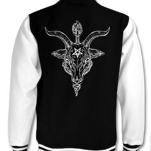 May include: Black and white varsity jacket with a white graphic of a goat's head with horns and a pentagram on its forehead.