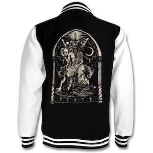 May include: A black and white varsity jacket with a white and black striped collar and cuffs. The jacket features a large graphic print on the back of a figure riding a creature with a snake wrapped around it. The graphic is set within an archway.