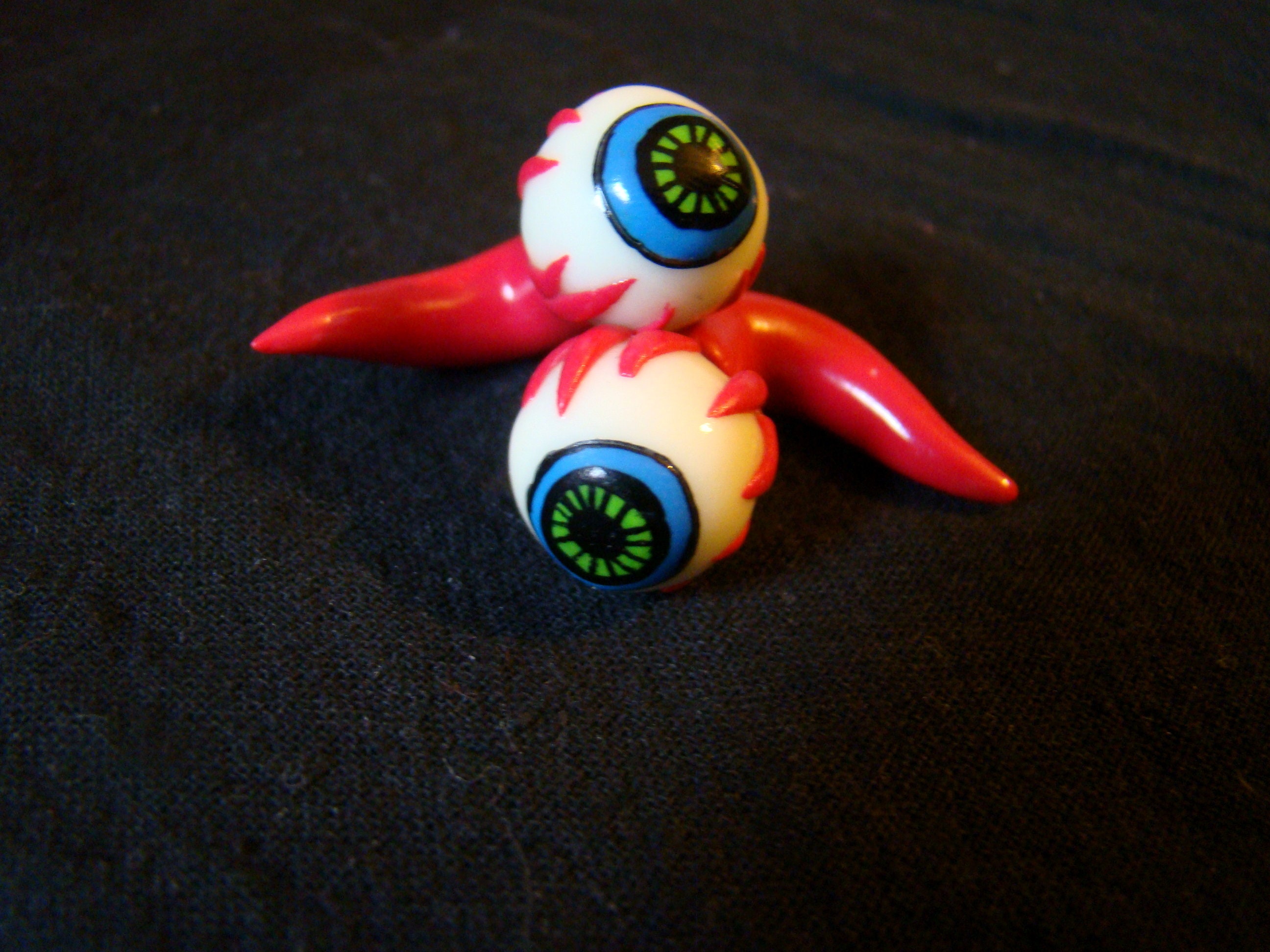 fake eyeballs on a thread