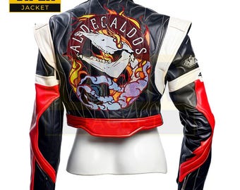 May include: Black leather jacket with red and white accents. The back of the jacket features a large embroidered patch with a skull and flames. The patch says "ALDECALDOS".