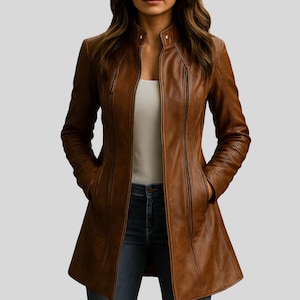 May include: A brown leather coat with a stand-up collar and a tailored fit. The coat features a zipper closure, front pockets, and vertical seam details. The long coat is knee-length and has a slight A-line shape.