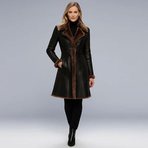 May include: A black leather coat with brown fur trim. The coat features a classic design with a notched collar and a flared skirt. The fur trim is visible on the collar, cuffs, and along the front edges of the coat. The coat is knee-length.