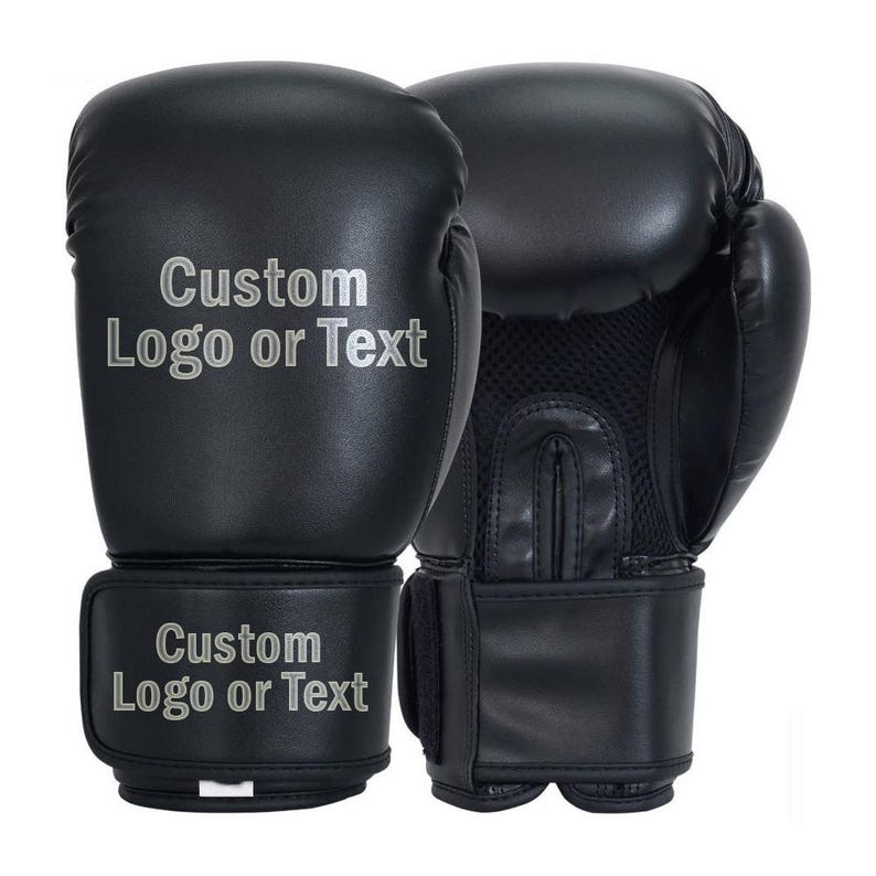 May include: Black boxing gloves with the text "Custom Logo or Text" in silver lettering on the front and wrist strap. The gloves have a mesh panel on the palm for ventilation.