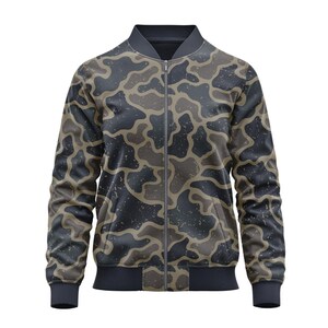 May include: A bomber jacket with a camouflage pattern in shades of gray, brown, and black. The jacket has a full zipper, two front pockets, and ribbed cuffs and hem. The fabric has a speckled texture.