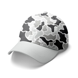 May include: A baseball cap with a light gray brim and a crown featuring a camouflage pattern in shades of gray and black. The cap has a curved bill and a button on top.