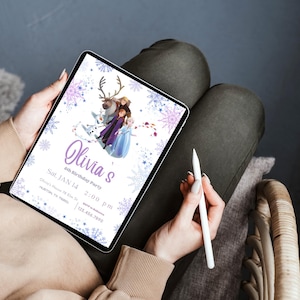 May include: A digital tablet displays a birthday party invitation with a Frozen theme. The invitation features the name "Olivia's" in purple script, along with the date, time, and location. The design includes snowflakes and characters from the movie.