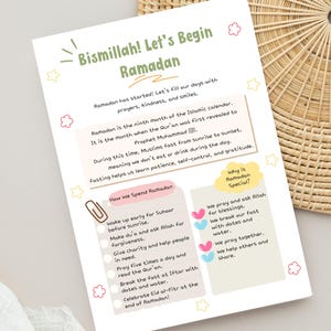 May include: A white paper with the text "Bismillah! Let's Begin Ramadan" and information about Ramadan. The paper includes text about fasting, prayers, and the importance of kindness. Decorative elements include pink and yellow stars and flowers.