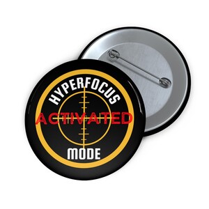 May include: Black button with a yellow circle and the text "HYPERFOCUS ACTIVATED MODE" in white and red. The circle has a target symbol inside.