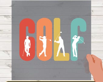 May include: DTF TRANSFER image with the word "GOLF" in large, colorful letters. Each letter has a different color: red, orange, yellow, and teal. Silhouettes of golfers are inside each letter. The text "READY TO PRESS" is at the bottom.