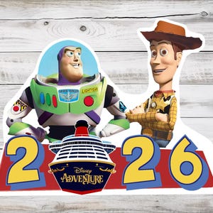 May include: A colourful graphic featuring Buzz Lightyear and Woody from Toy Story. The characters are positioned above the numbers 2 and 6, with a Disney Adventure cruise ship logo in between. The background is a light wood grain.