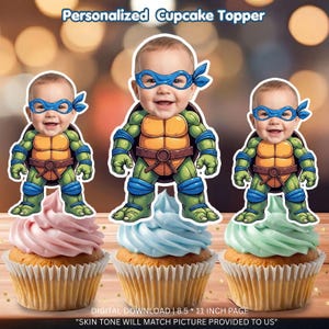 May include: Three cupcakes with baby faces as Teenage Mutant Ninja Turtle toppers. The cupcakes have pink, blue, and green frosting. The image includes the text "Personalized Cupcake Topper" and "DIGITAL DOWNLOAD | 8.5 * 11 INCH PAGE".