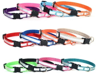 May include: A collection of adjustable pet collars in various colors including purple, pink, blue, orange, red, beige, green, and teal. Each collar features a reflective silver strip, a black plastic side-release buckle, and a metal D-ring.